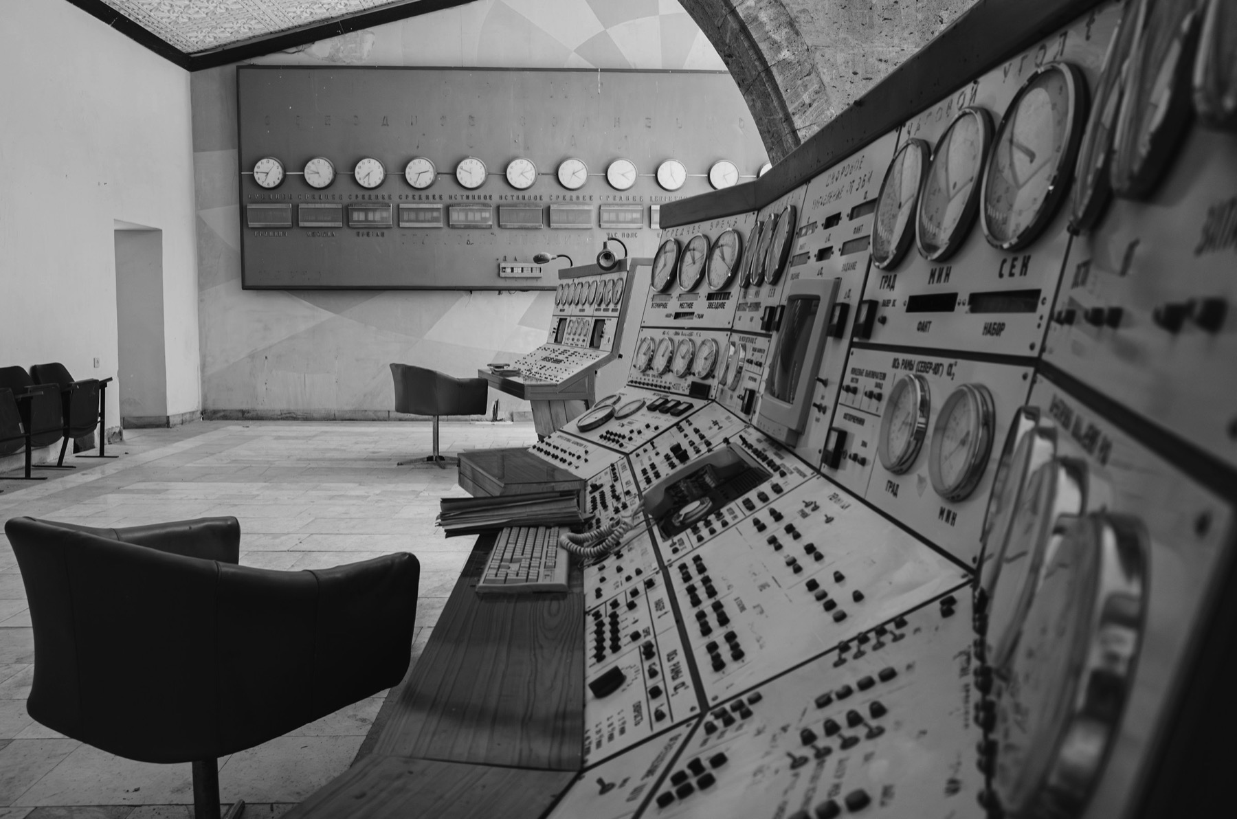 An analogue control room with rows of instrument panels